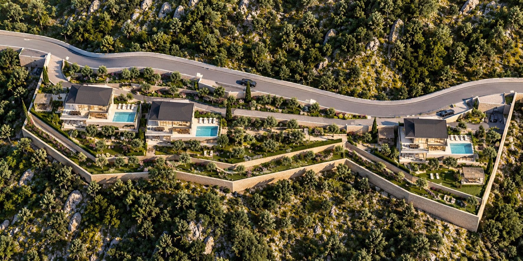 View from above of the whole site: the road along the top, villas 2 and 3 together on the left and villa 1 on its own on the right, each with a pool, set in terraced gardens with olive trees.